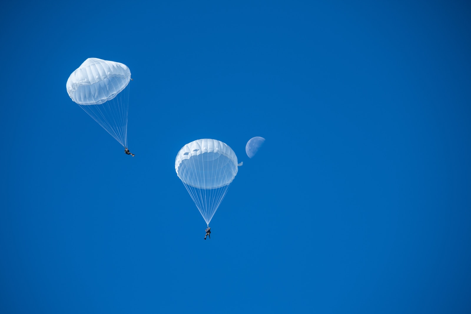 two white parachutes